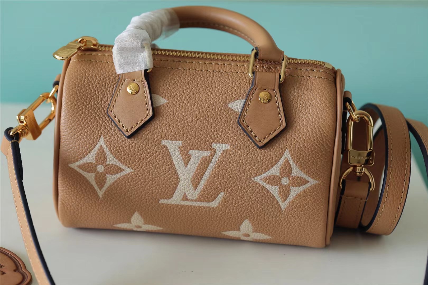Louis Vuitton Nano Speedy Monogram Empreinte Arizona Beige / Cream For Women, Women’s Handbags, Shoulder And Crossbody Bags 6.3in/16cm